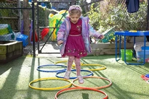 Jumpers nursery children playing