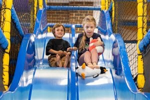 kids on slide soft play
